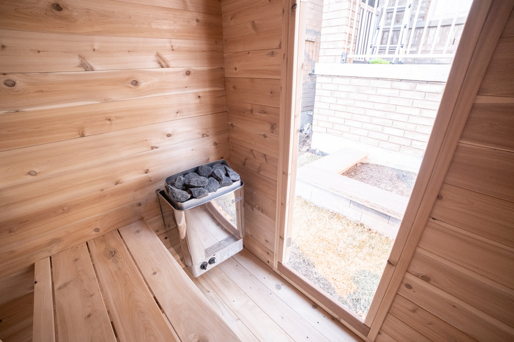 Heater and window inside the Dundalk CT Granby 3-Person Outdoor Cabin Sauna