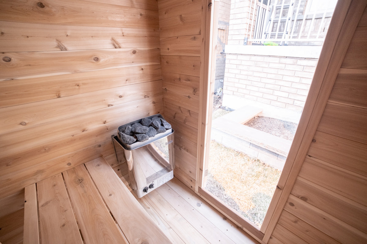 Heater and window inside the Dundalk CT Granby 3-Person Outdoor Cabin Sauna