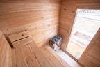 Interior of the Dundalk CT Granby 3-Person Outdoor Cabin Sauna with bench, heater and window