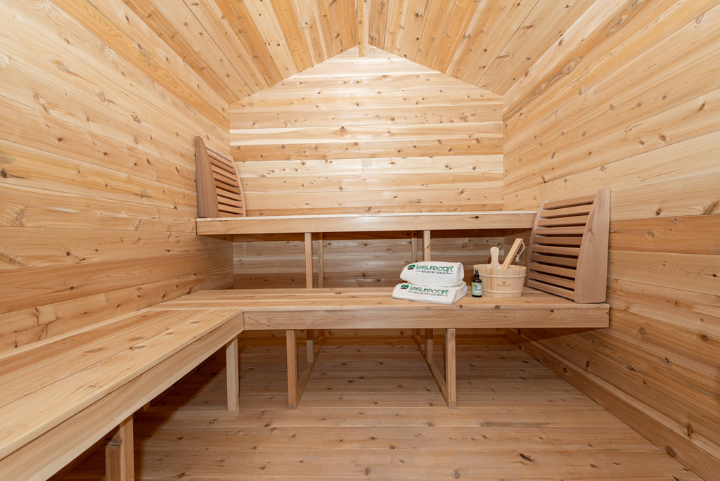 Wide interior view of the Dundalk CT Georgian 6-Person Cabin Sauna with Porch with corner benches