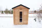 Front view of the Dundalk CT Granby 3-Person Outdoor Cabin Sauna in the snow