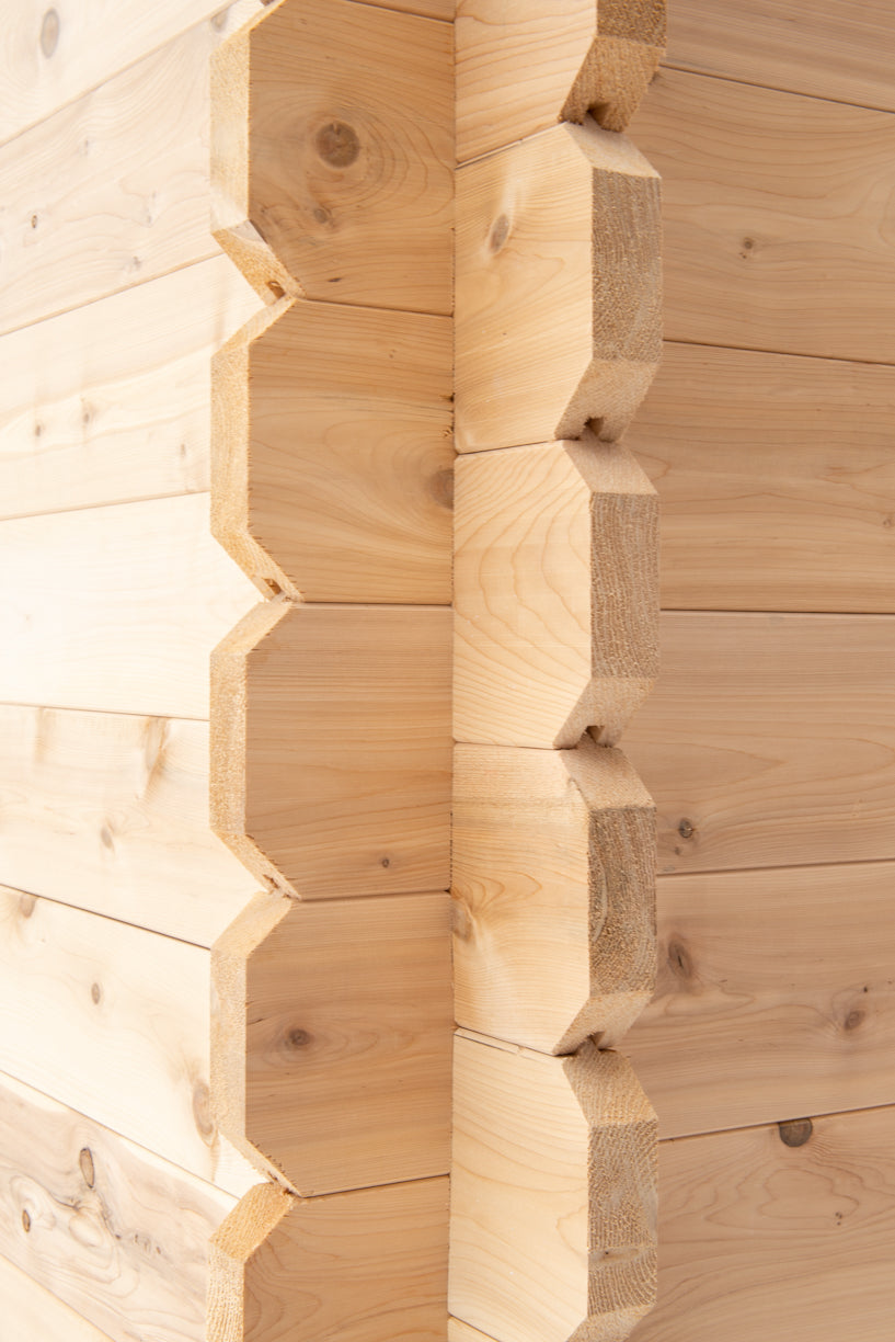 Log corner joint detail on the Dundalk CT Granby 3-Person Outdoor Cabin Sauna