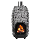 Huum Hive Flow 9.8kW wood-burning sauna stove with stacked sauna stones, chimney pipe and fire burning