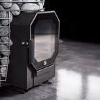 Angled view of the glass fire door on the Huum Hive Flow 9.8kW wood-burning sauna stove