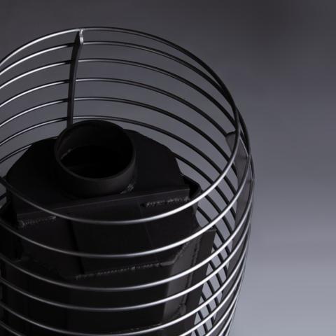 Close-up of the stainless steel stone cage and chimney connection on the Huum Hive Wood 13kW wood-burning sauna stove