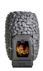Huum Hive Wood LS 17kW wood-burning sauna stove with firebox extension, stacked sauna stones and fire burning