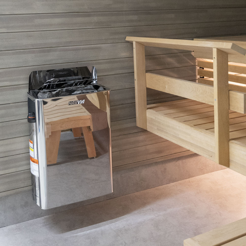 Harvia The Wall 6kW electric sauna heater installed in a sauna with wooden railing