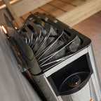 Top angle view of the Harvia The Wall 6kW electric sauna heater with sauna stones and control