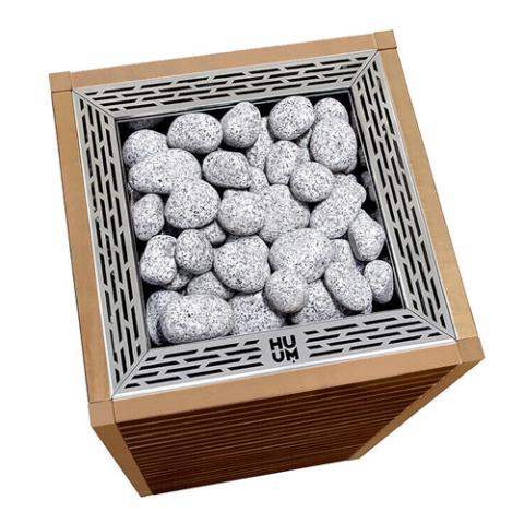 Top view of the Huum Core 9kW Sauna Heater with silver stone cage and sauna stones