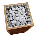 Top view of the Huum Core 10.5kW Sauna Heater with silver stone cage and sauna stones