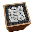 Top view of the Huum Core 10.5kW Sauna Heater with black stone cage and sauna stones
