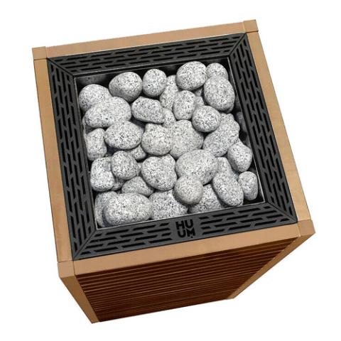 Top view of the Huum Core 9kW Sauna Heater with black stone cage and sauna stones