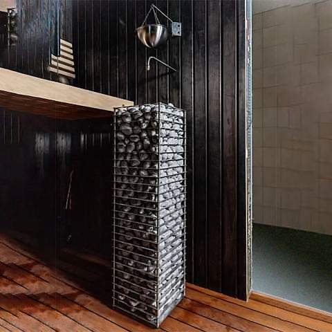 Huum Cliff 9kW Sauna Heater in a dark sauna with wooden floor