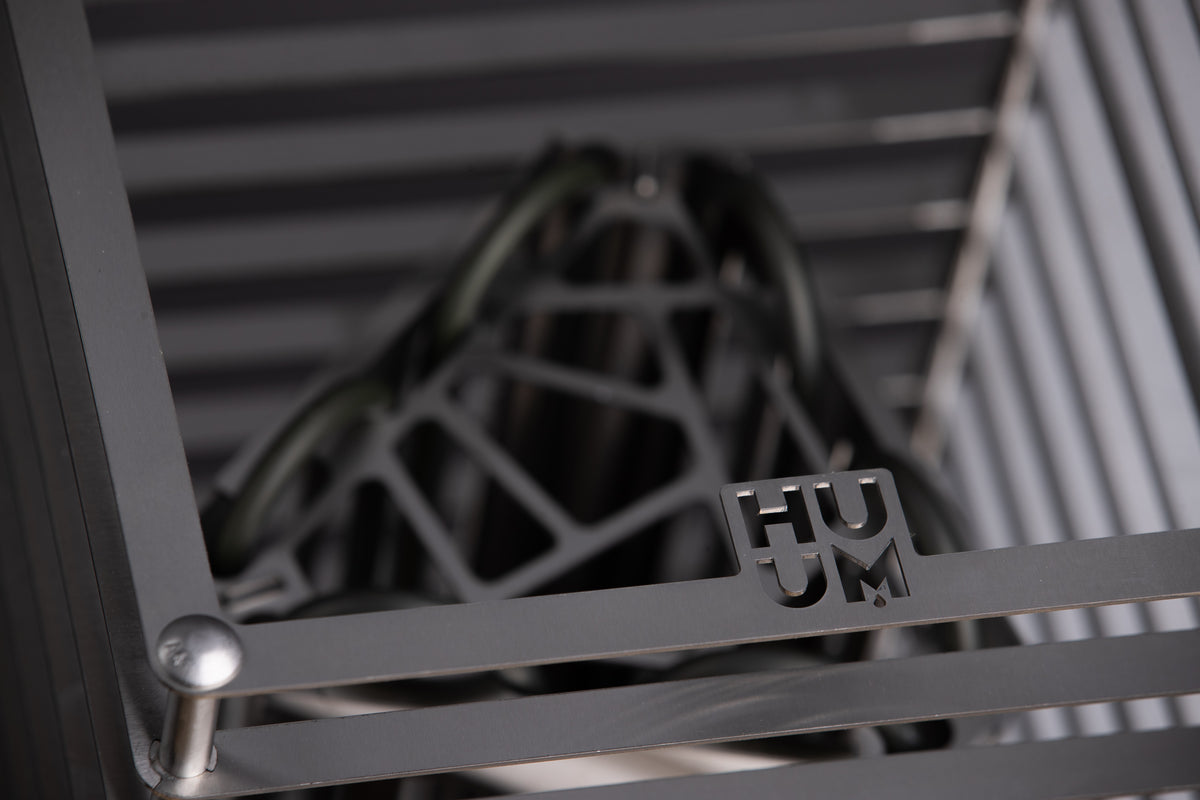 Close-up of the Huum logo and cage detail on the Huum Cliff 6kW Sauna Heater