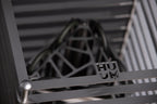 Close-up of the Huum logo and cage detail on the Huum Cliff 10.5kW Sauna Heater