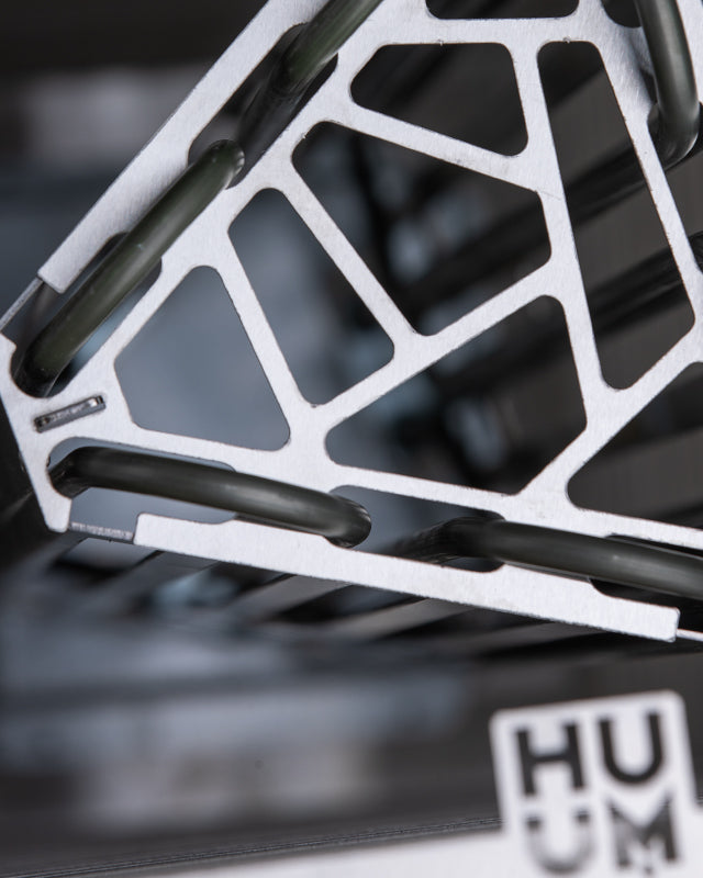 Close-up of the Huum logo on the Huum Cliff 10.5kW Sauna Heater stone cage
