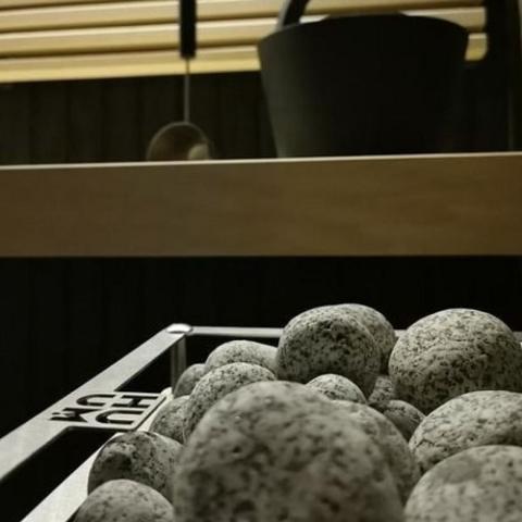 Close-up of sauna stones on the Huum Cliff Mini 3.5kW Sauna Heater