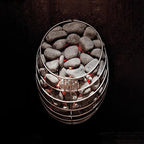 Huum Drop 7.5kW Sauna Heater with sauna stones and glowing red elements