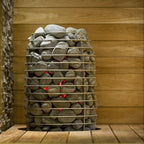 Huum Hive Mini 9kW Sauna Heater in a sauna with sauna stones and red glowing elements