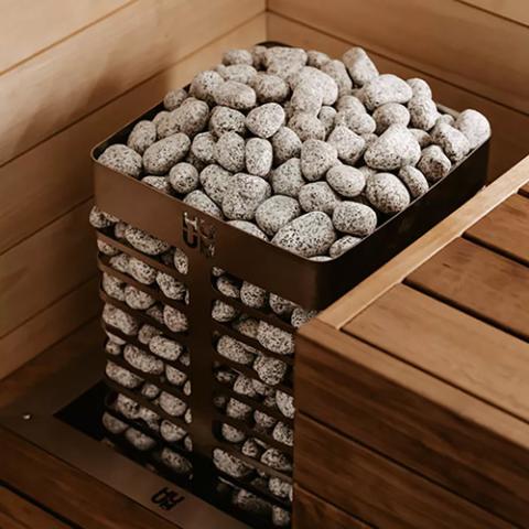 Top view of the Huum Steel 10.5kW Sauna Heater stone cage in a sauna