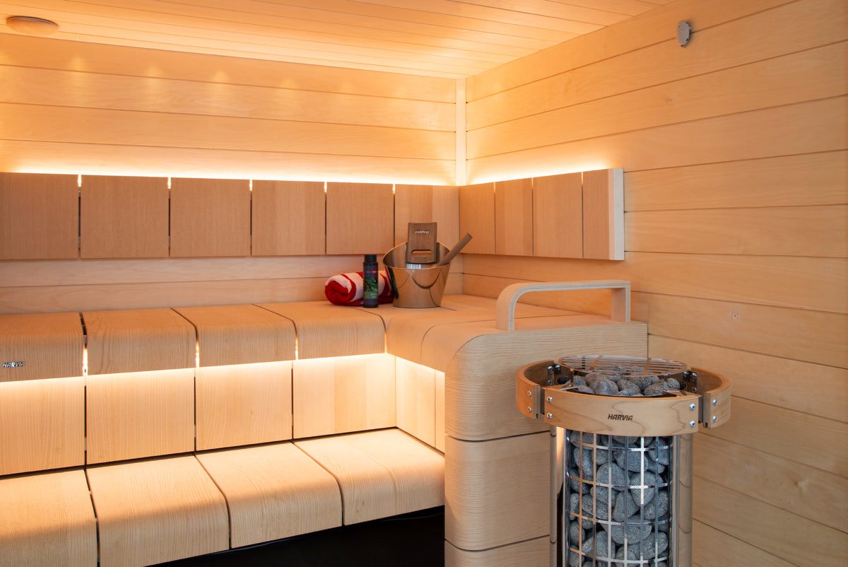 Harvia Cilindro PC110E 10.5kW Sauna Heater in a sauna with safety railing
