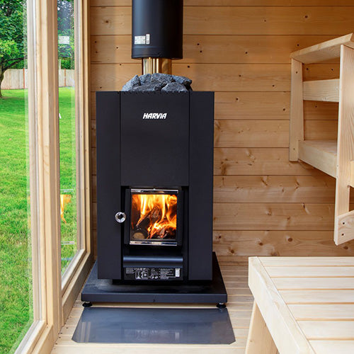 Harvia Linear 18 Compact 14.3kW Wood-Burning Sauna Stove installed in a sauna with wooden bench and window