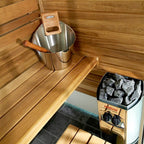 Harvia Vega 3.5kW electric sauna heater in a sauna with bucket and ladle