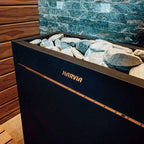 Close-up of the Harvia logo and sauna stones on the Harvia Virta Pro HL160E 16kW electric sauna heater