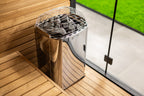 Harvia Club K15G 15kW electric sauna heater in an outdoor sauna with glass wall