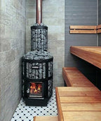 Harvia Legend 150 16kW Wood-Burning Sauna Stove installed in a sauna with tiled floor and wooden benches