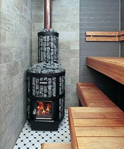 Harvia Legend 240 SL 21kW Wood-Burning Sauna Stove with Exterior Feed installed in a sauna with tiled floor and wooden benches