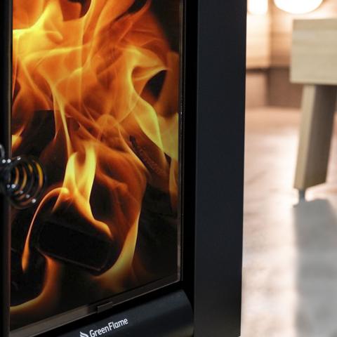 Close-up of flames burning behind the glass door of the Harvia Linear 22 GreenFlame ES 15.7kW Wood-Burning Sauna Stove with Water Tank