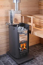 Harvia Pro 26 26kW Wood-Burning Sauna Stove installed in a sauna with wooden benches