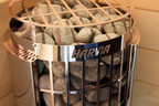 Close-up of the stone-filled cage on the Harvia Cilindro PC90E 9kW electric sauna heater