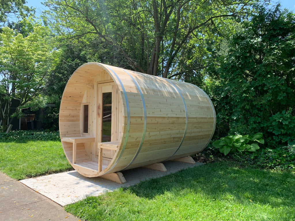 Dundalk CT Tranquility 6-Person Outdoor Barrel Sauna in a garden setting