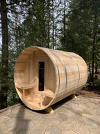 Front view of the Dundalk CT Serenity 5-Person Outdoor Barrel Sauna on a gravel pad