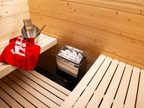 Harvia KIP 4.5kW Sauna Heater in a sauna with red towel on the bench
