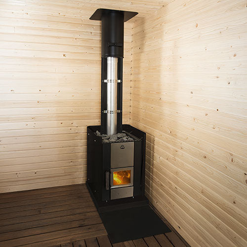 Narvi Kuru 20 16kW wood burning sauna stove with fire burning and a chimney in the corner of a pine-panelled sauna