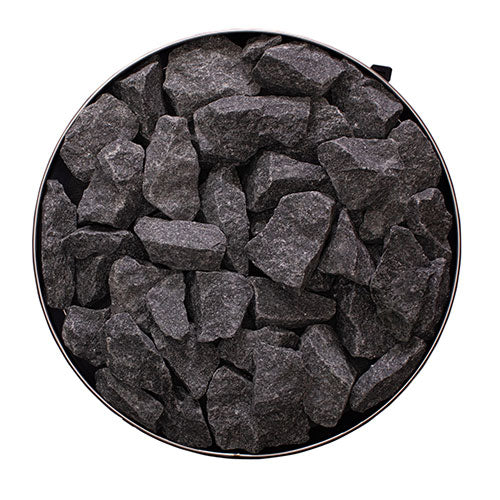 Top view of the round stone compartment filled with sauna stones on the Narvi Luosto 16kW wood burning sauna stove