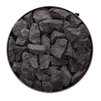 Top view of the round stone compartment filled with sauna stones on the Narvi Luosto 16kW wood burning sauna stove