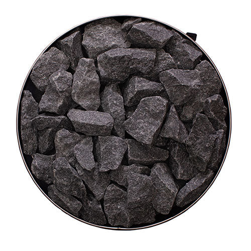 Top view of the round stone compartment filled with sauna stones on the Narvi Luosto 16kW wood burning sauna stove
