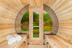 Interior of the Dundalk CT 6-Person Outdoor Barrel Sauna with Half-Moon Windows looking toward the door and half-moon window