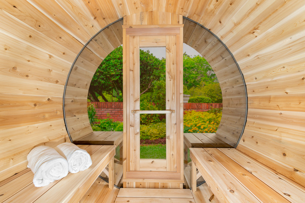 Interior of the Dundalk CT 6-Person Outdoor Barrel Sauna with Half-Moon Windows looking toward the door and half-moon window
