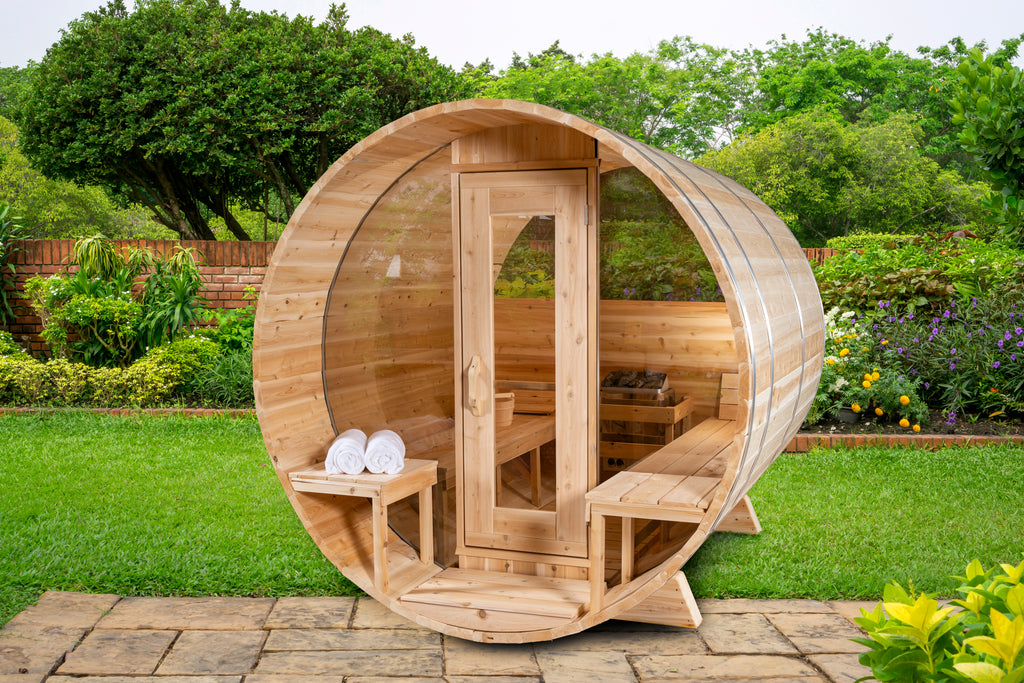 Front view of the Dundalk CT 6-Person Outdoor Barrel Sauna with Half-Moon Windows in a garden
