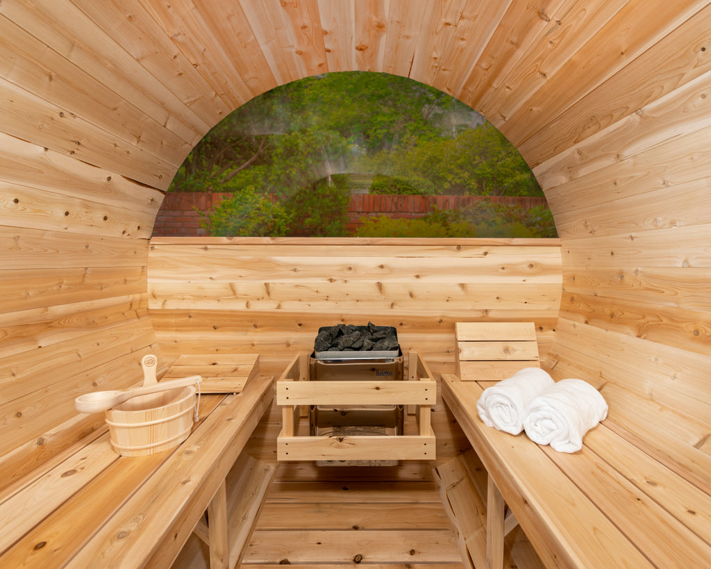 Interior of the Dundalk CT 6-Person Outdoor Barrel Sauna with Half-Moon Windows with benches and half-moon window