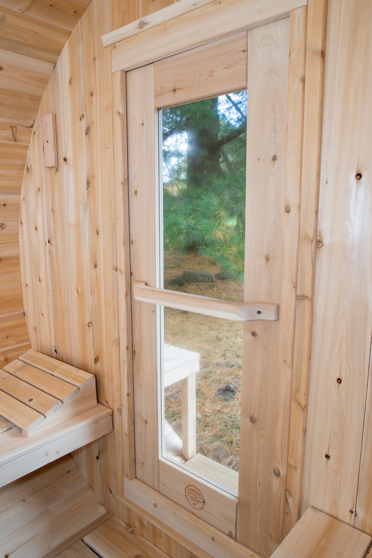 Glass door inside the Dundalk CT Serenity 5-Person Outdoor Barrel Sauna