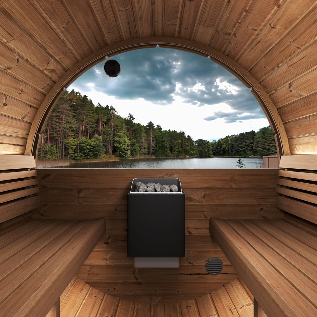 Interior of the SaunaLife E6 Ergo 3-person outdoor barrel sauna with benches, heater and panoramic window over a lake