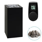 Huum Core 6.5kW Sauna Heater in black metal with UKU control panel and sauna stones