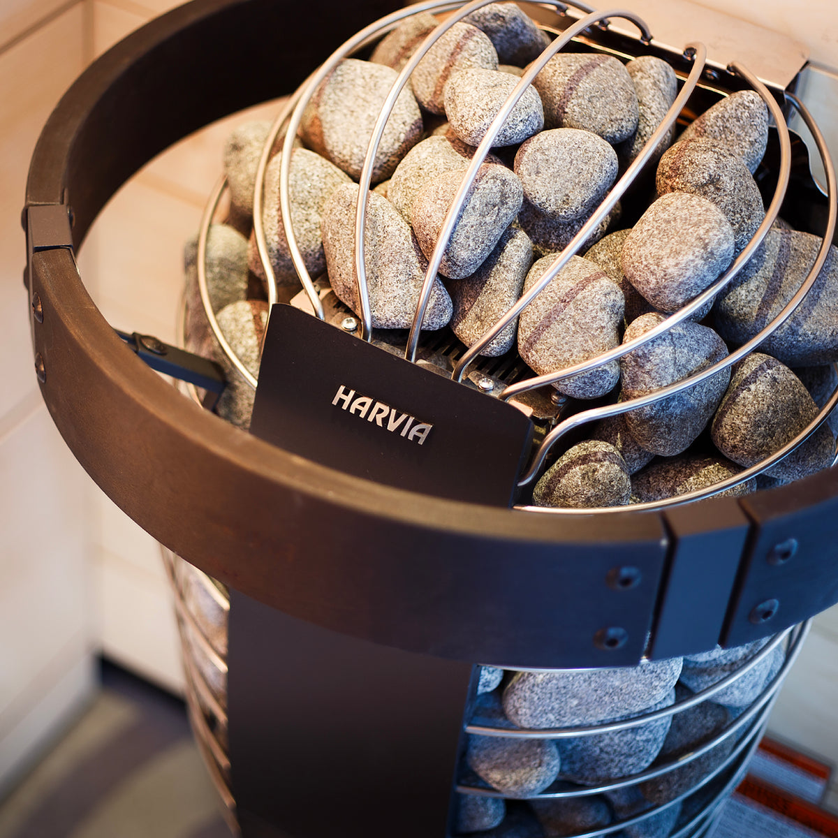 Close-up of the Harvia logo and stone cage on the Harvia Spirit 9kW Sauna Heater