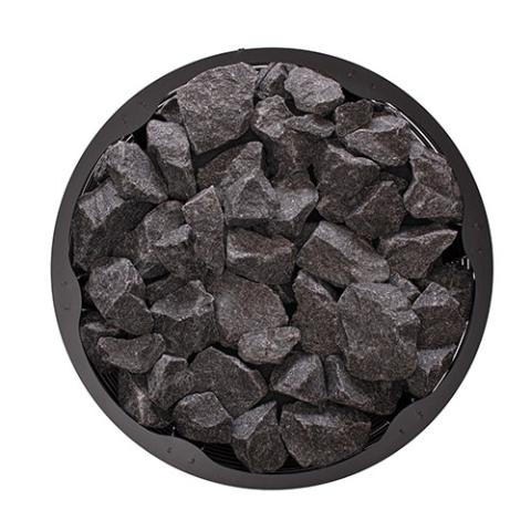 Top view of the round stone compartment filled with sauna stones on the Narvi Inari Plus 16kW wood burning sauna stove